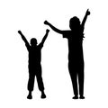 A happy family. Silhouette of a woman with her son joyfully raising their hands.